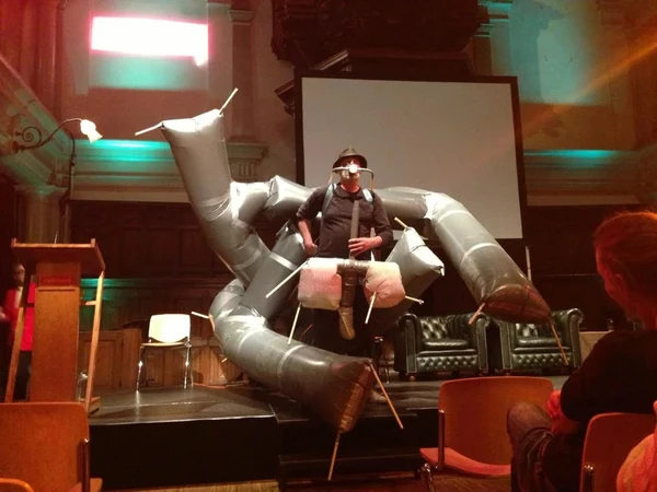 On the image you see the artists in one of his mobile trash bag installations.